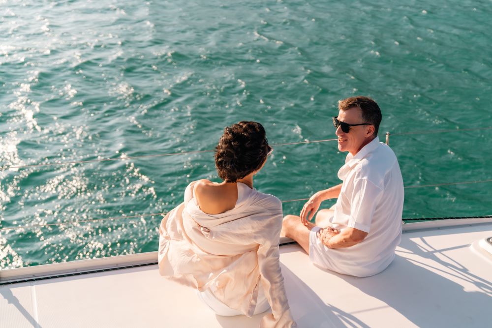 Couple enjoying the view from the yacht 